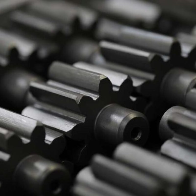 Black Oxide Finishing Black Metal Parts Lying on Table Closeup