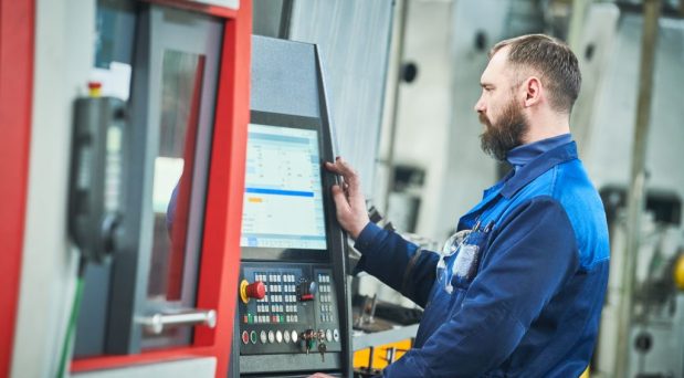 Industrial,Worker,Operating,Cnc,Machine,At,Metal,Machining,Industry Industrial,Worker,Operating,Cnc,Machine,At,Metal,Machining,Industry