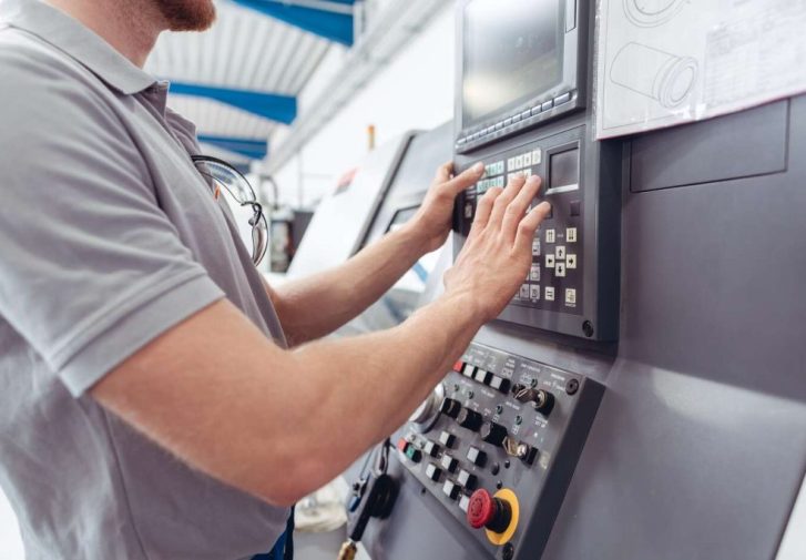 worker-programming-industrial-cnc-machine-tool-image Worker Programming Industrial CNC Machine Tool